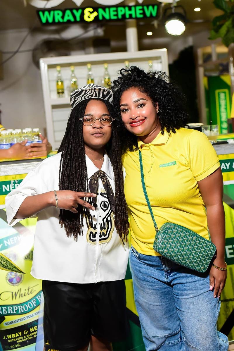 Reggae star Koffee (left) and Kerry Ann Bryan, Wray Rum brand manager, pause their confab for a quick photo.