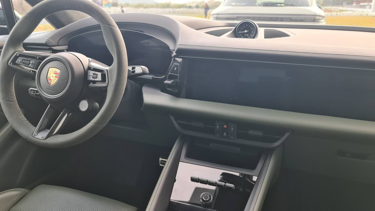A look at the floating centre console highlights the shift toward a minimalist aesthetic, replacing the traditional gear lever with a sleek toggle and providing a spacious bridge that houses the tactile climate controls and wireless charging pad.