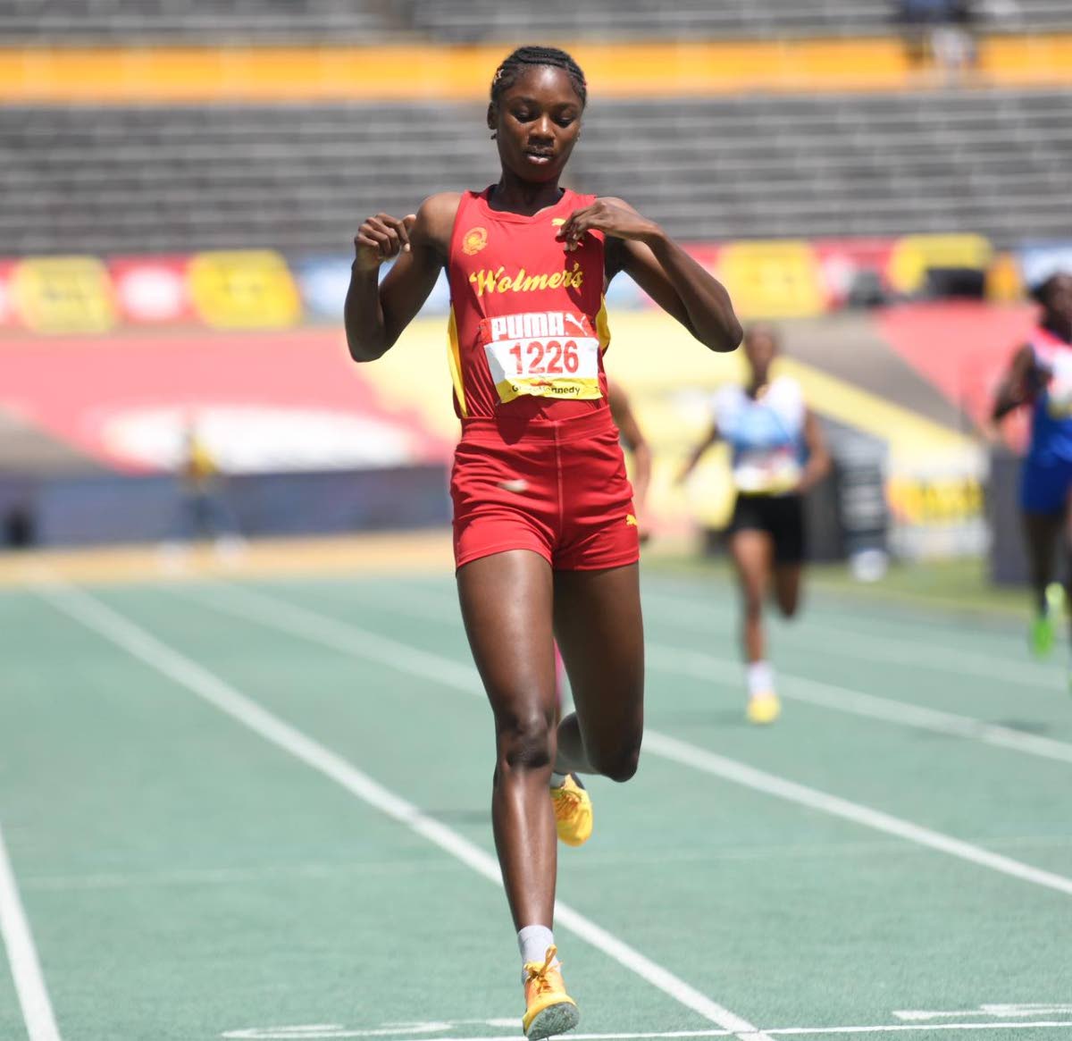 Wolmer’s Girls School standout Sashana East winning her girls’ Class Two 200m heat at Champs 2026.