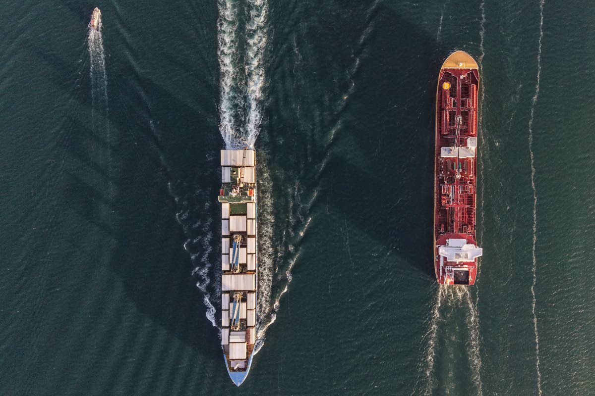 A bulk carrier and a cargo ship transit the Panama Canal in Panama City on March 12, 2026. (AP Photo/Matias Delacroix)