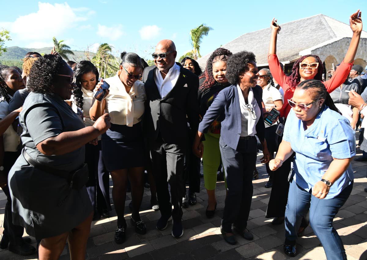 Tourism Minister Edmund Bartlett with tourism workers at the April 2, 2026 opening of Half Moon, where he announced that the Tourism Workers Pension Scheme has grown to $6 billion and outlined plans for a health plan next. (Ashley Anguin photo).