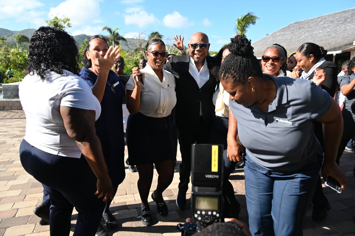 Tourism Minister Edmund Bartlett with tourism workers at the April 2, 2026 opening of Half Moon, where he announced that the Tourism Workers Pension Scheme has grown to $6 billion and outlined plans for a health plan next. (Ashley Anguin photo)