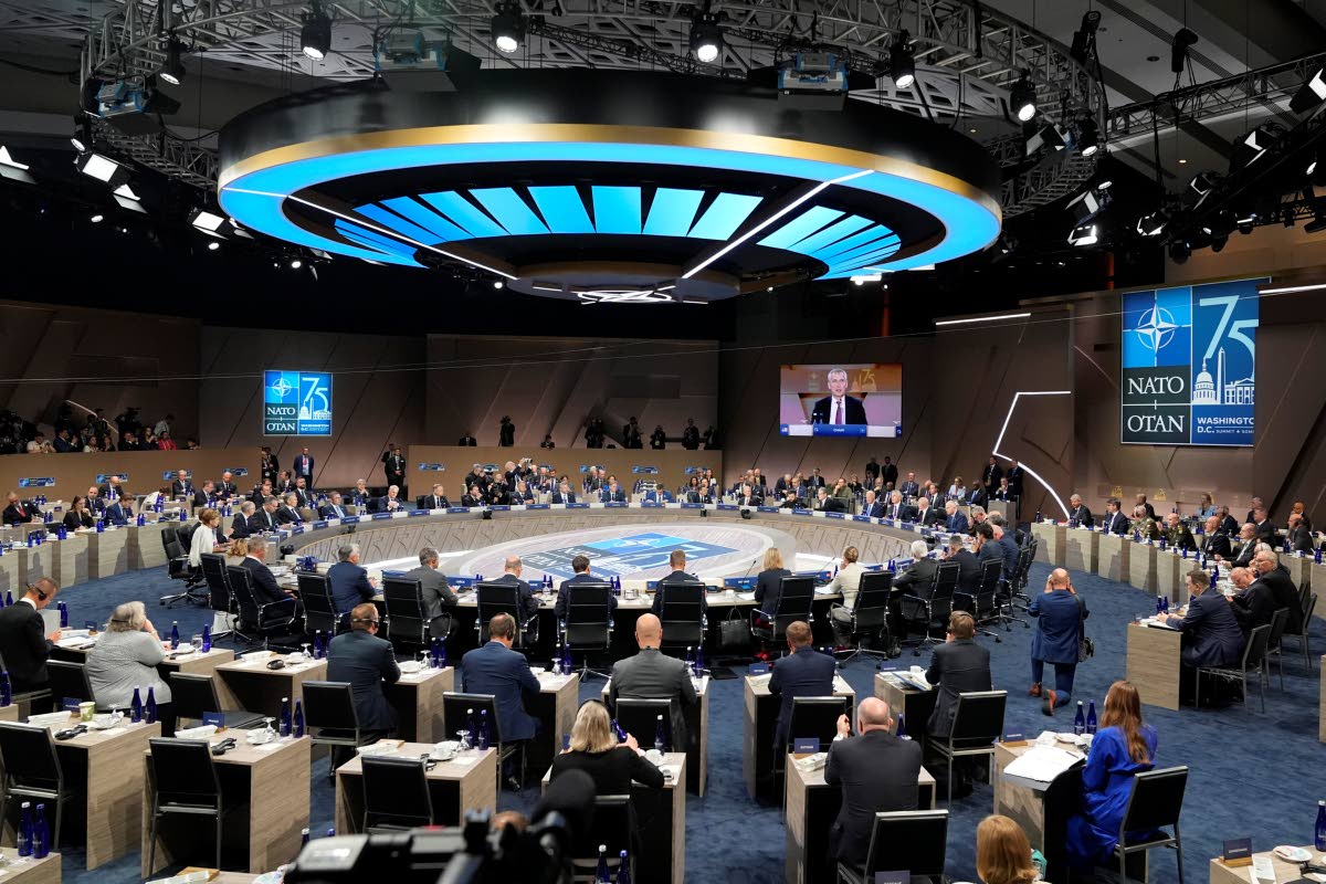 In this file photo, leaders take their seats for a meeting of the NATO-Ukraine Council during the NATO summit in Washington, July 11, 2024. 