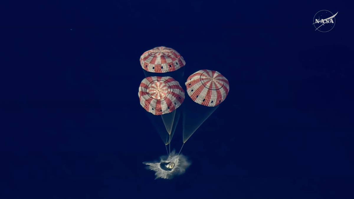 In this image from video provided by NASA, the Artemis II Orion capsule splashes down in the Pacific Ocean, on April 10, 2026. (NASA via AP)