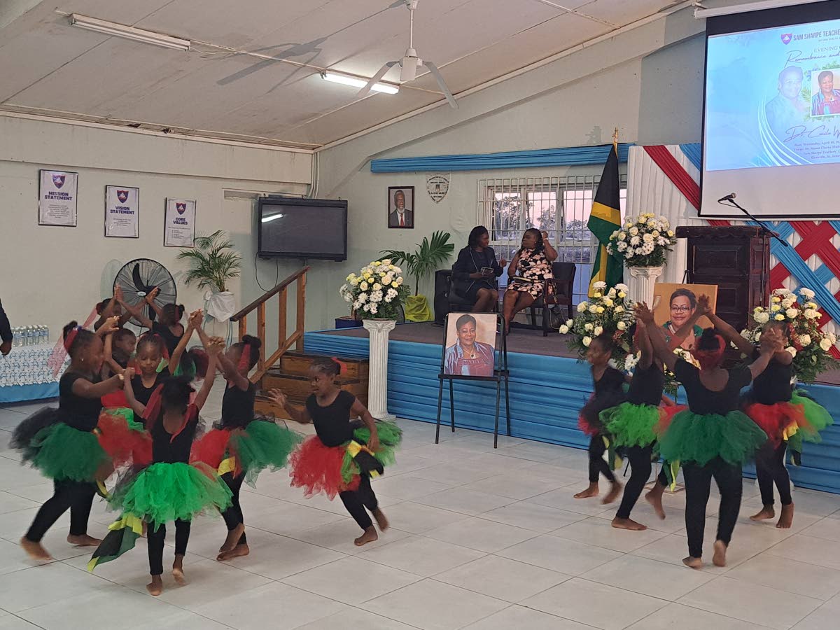 Students of the Montego Bay-based EBER Preparatory School perform a cultural item during a remembrance and honour service for Dr Cecile Walden on Wednesday.