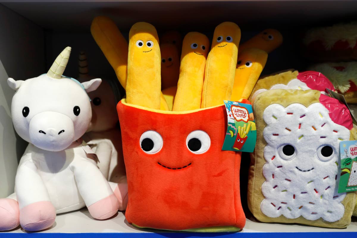 Plush toys are displayed at a Camp store in New York. Camp, November 21, 2019. (AP Photo/Mark Lennihan, File)