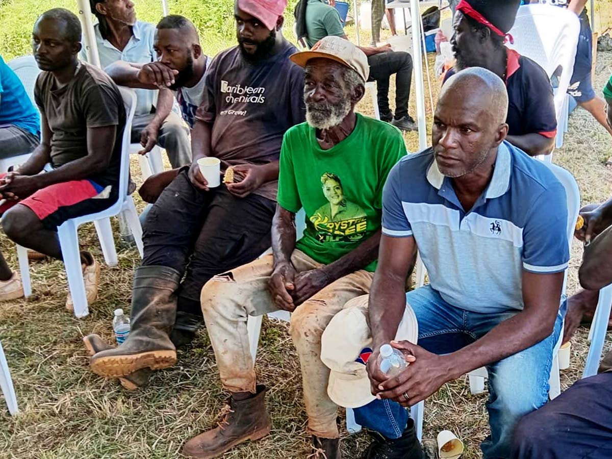 Kemarco McAnuff (left) and other farmers at the ground-breaking ceremony.