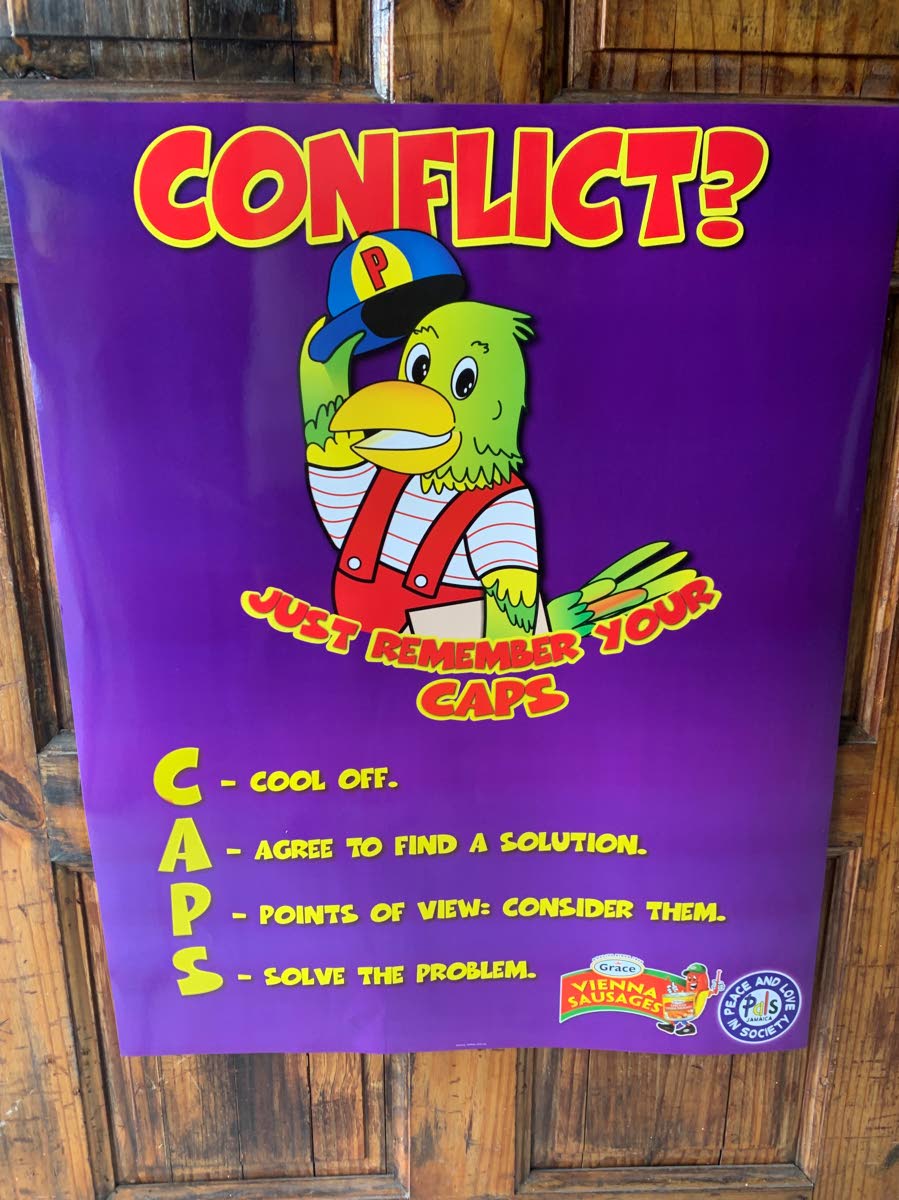 A Peace and Love in Society (PALS) poster on a classroom door at a local school. 