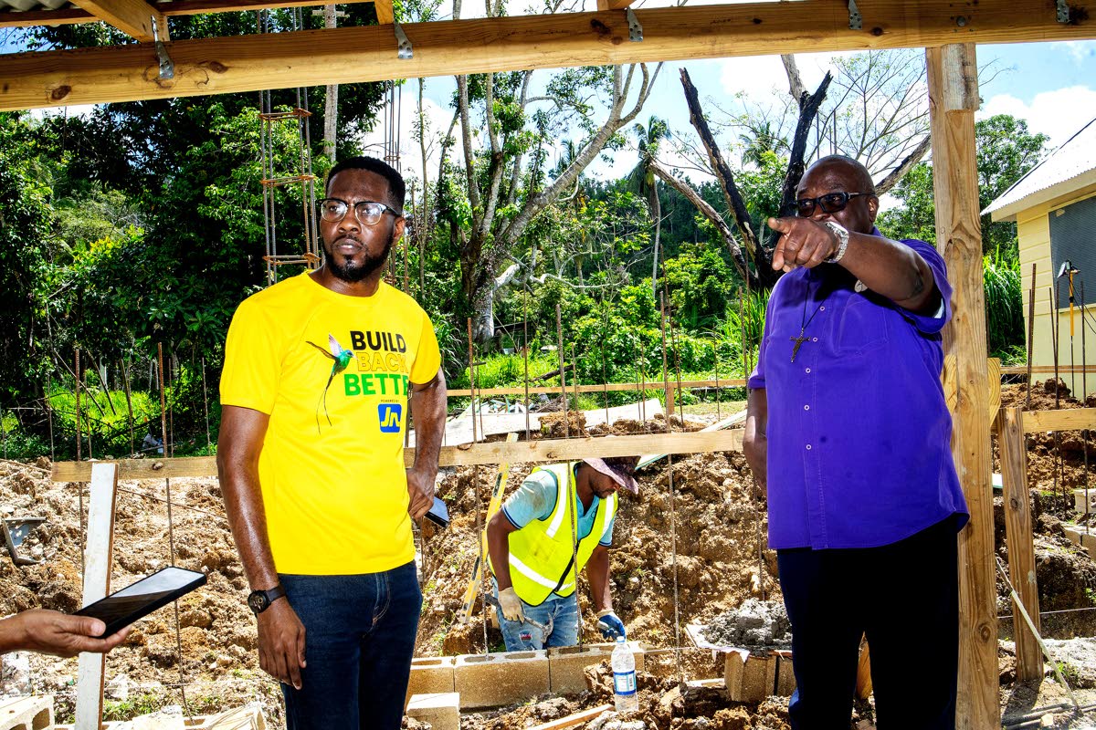 Omar Wright (left), lead, environment and community development officer at the JN Foundation, observes construction taking place at the Blessed Assurance home for the vulnerable in St James operated by Mustard Seed Communities (MSC). The facility cares for
