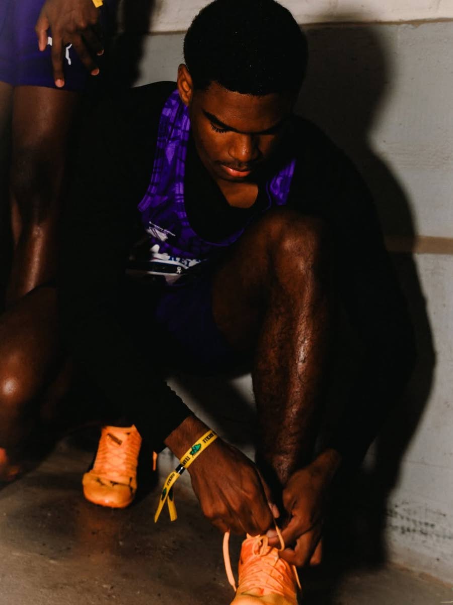 Getting ready! A Kingston College athlete makes last-minute adjustments before competiting at the Penn Relays in Pennsylvania last week.