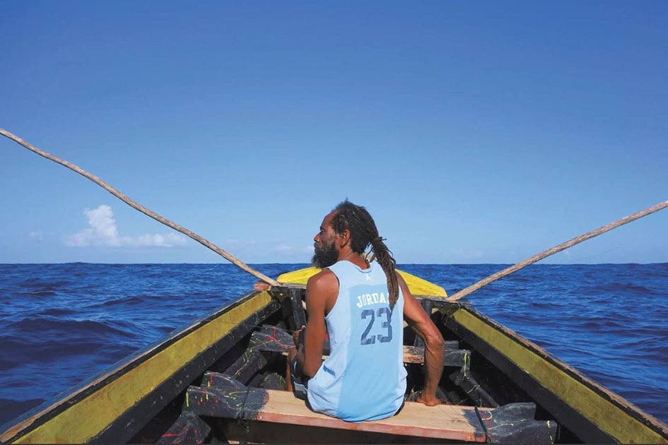 A Jamaican fisherman heads out to sea. 