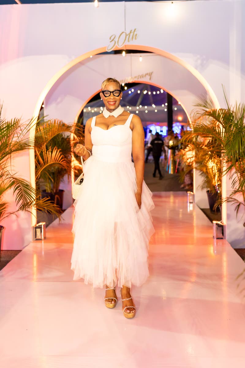 Charlene Brevitt-Rose turns heads in white, the tulle and pearl necklace making a stylish statement.