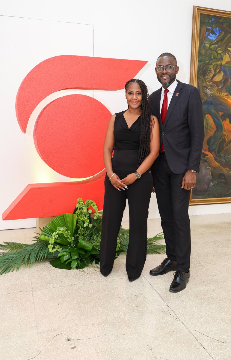 Daphia Depass, business banking officer at Scotiabank, pairs up with Oral Heaven, centre director at Scotia Private Banking.