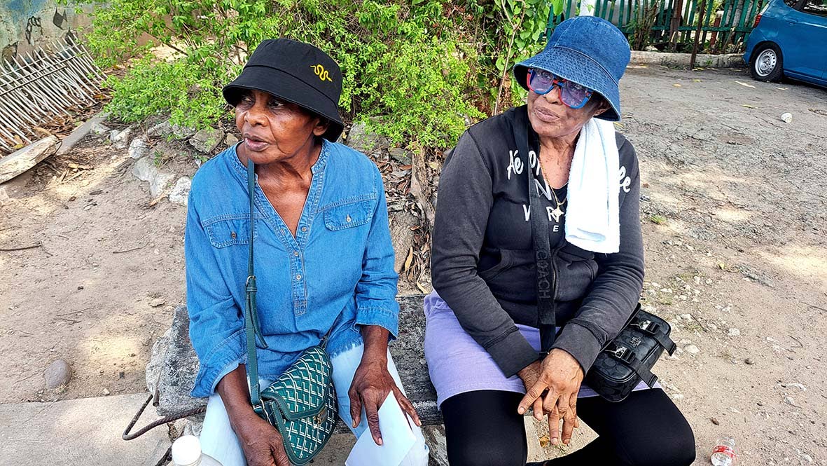 Marvalyn Willis (left), mother of Marlon Thompson, and Delaree McLaughlin, mother of Oniel Campbell, at St Johns Road in Spanish Town earlier this week. Both women lost their sons in a motor vehicle crash in Trelawny on July 17.