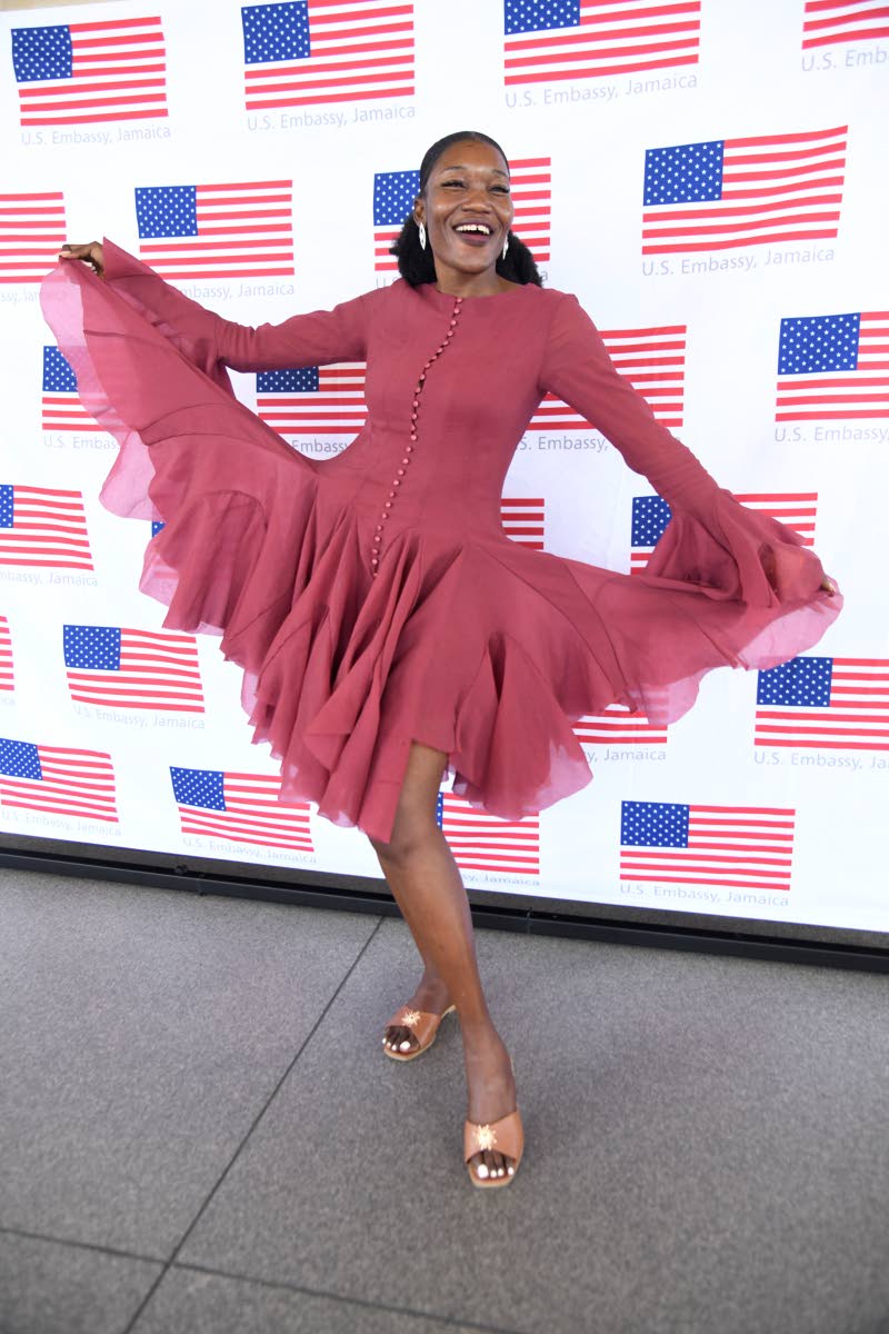 Tishauna Mullings, chief social innovator at NexxStepp, wears a flared-sleeve mini dress with a ruffled hem from Rose’s Couture.