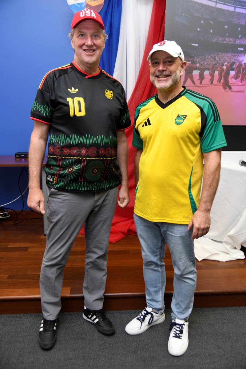 Scott Renner (left), chargé d’affaires at the United States Embassy in Kingston, and Michael Lavallee, public affairs attaché, are photographed at the World Cup final watch party hosted by the embassy.