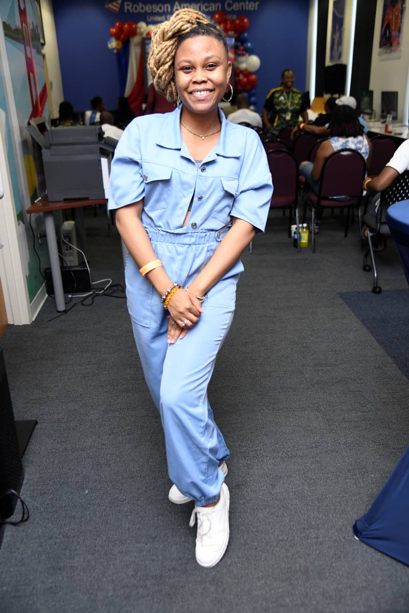 Godiva Golding, founder of STEAMHouse Network Limited and an International Visitor Leadership Programme alumna, rocks full denim with white low-top sneakers. 