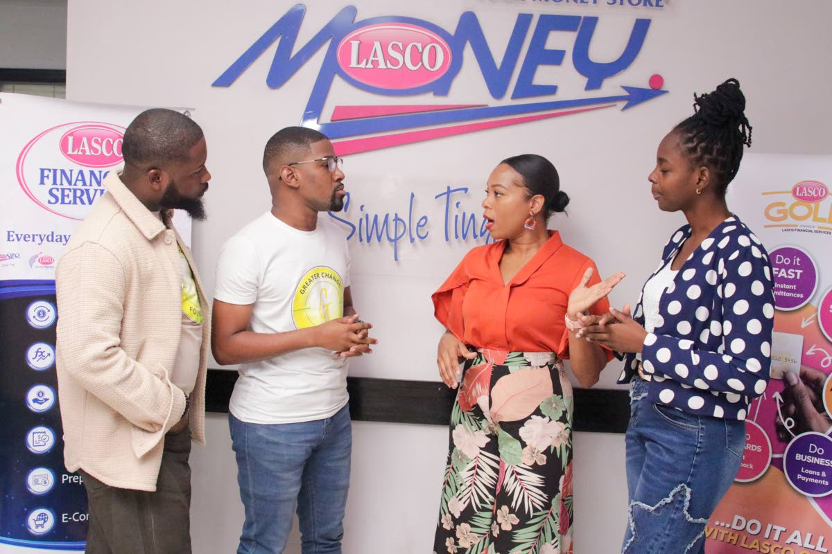 Donrick Dixon (left), director of people and culture at the Greater Change Foundation; Warren Bernard, board chairman of the Foundation; Samantha Fuller-Maragh (second right), brand manager – card services at LASCO Financial Services; and Celine Barton, 