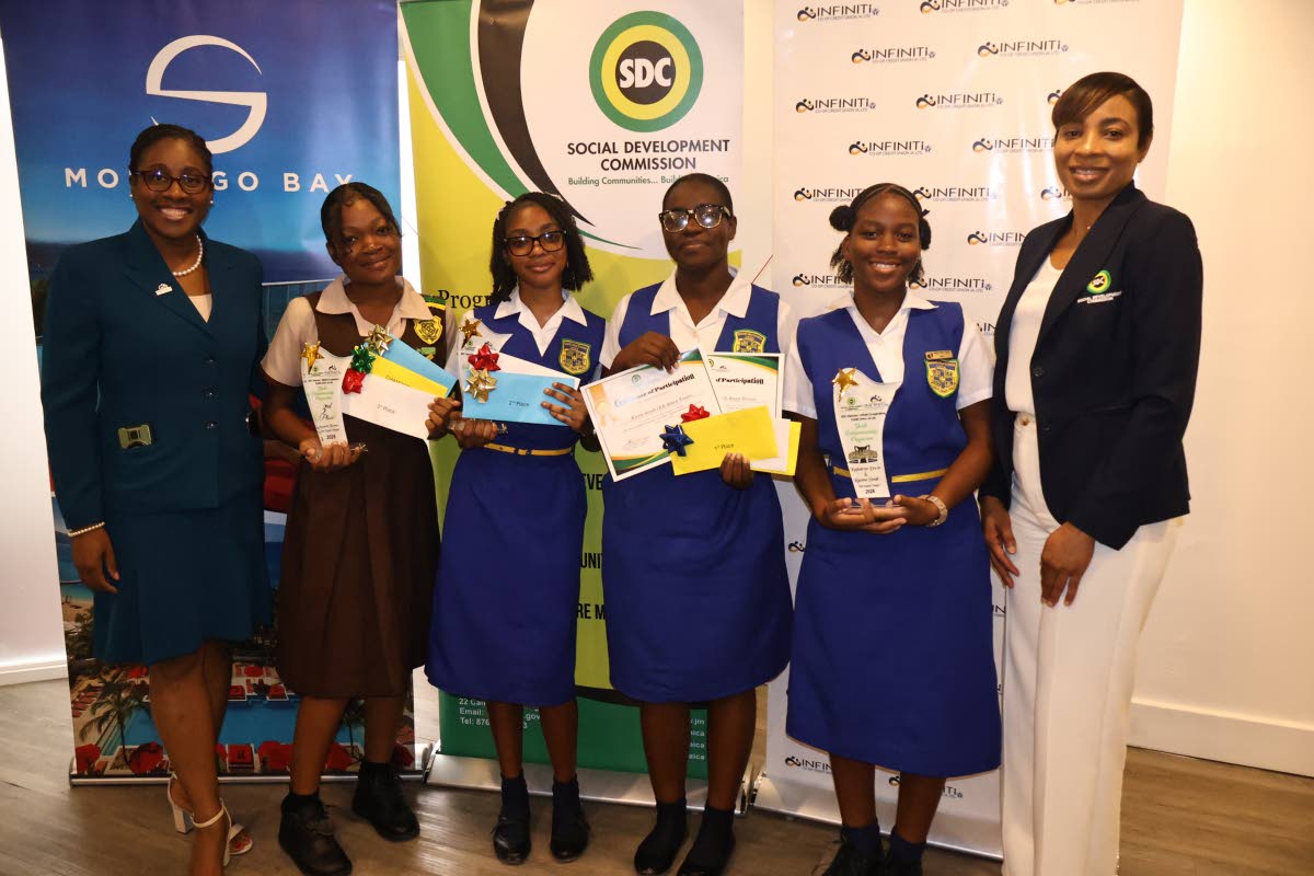 Dianne Wallace (left), 
marketing and communications manager at Infiniti Co-operative Credit Union,  and Tova Trench-Anderson (right), SDC parish manager, with a few of the winners at the closing and awards ceremony.