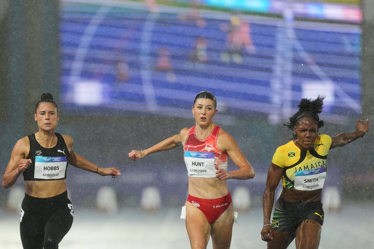 From left: Zoe Hobbs of New Zealand, Amy Hunt of England, and Jonielle Smith of Jamaica compete in a women’s 100 metres semi-final at the Commonwealth Games in Glasgow, Scotland, yesterday.