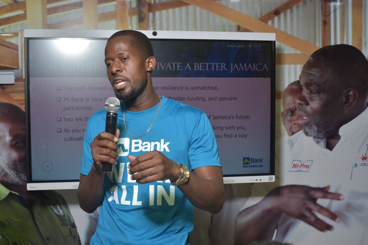 Janordo Patterson, credit solutions manager in JN Bank’s Business Banking Division, addresses patrons at the recent Denbigh Agricultural, Industrial and Food Show in Clarendon about JN Bank’s business solutions. 