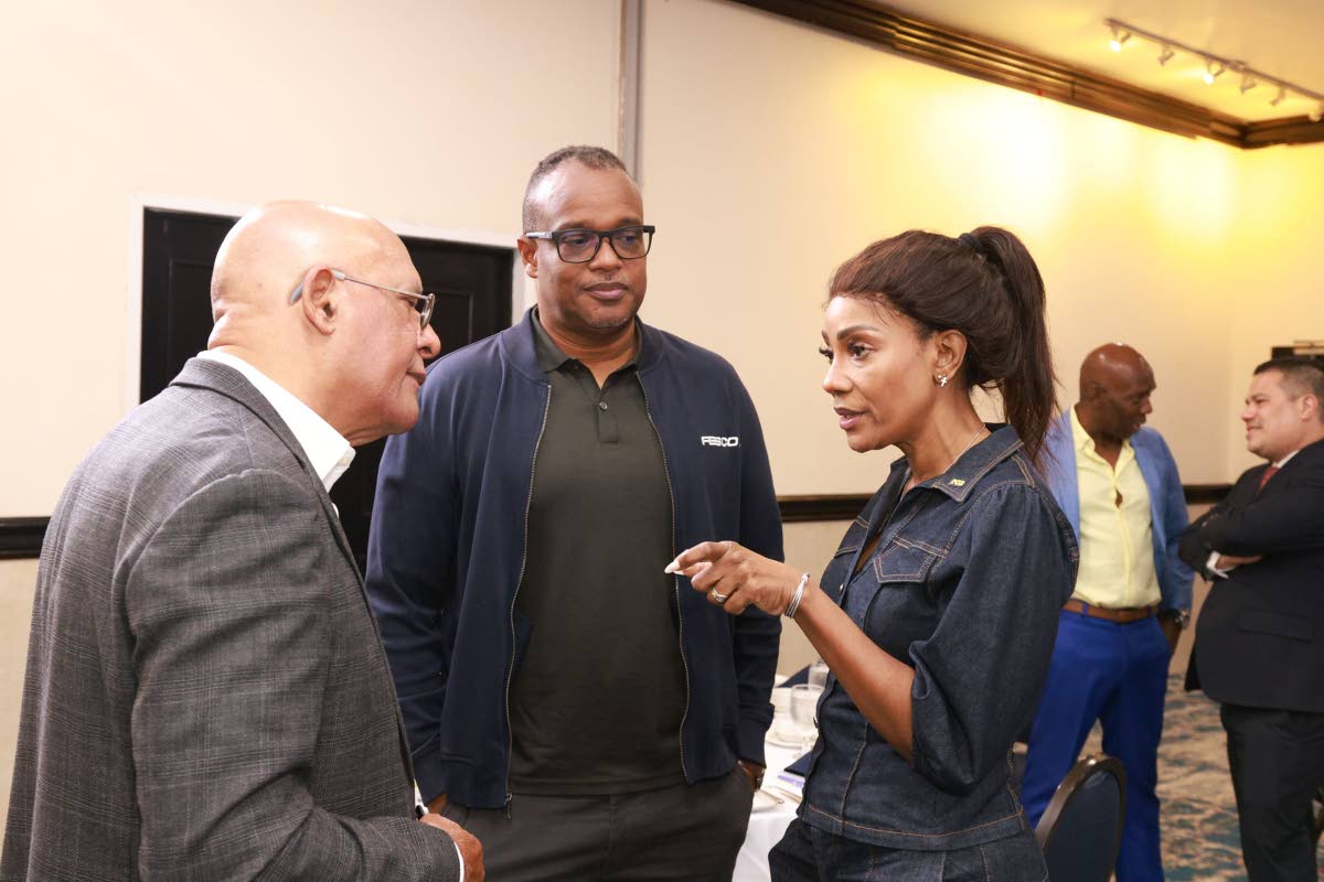 (From left) Errol McGaw, Jeremy Barnes, and  Belinda Williams at the NCBJ Corporate Breakfast. Hugh Graham and Matthew Samuda are seen in the background.