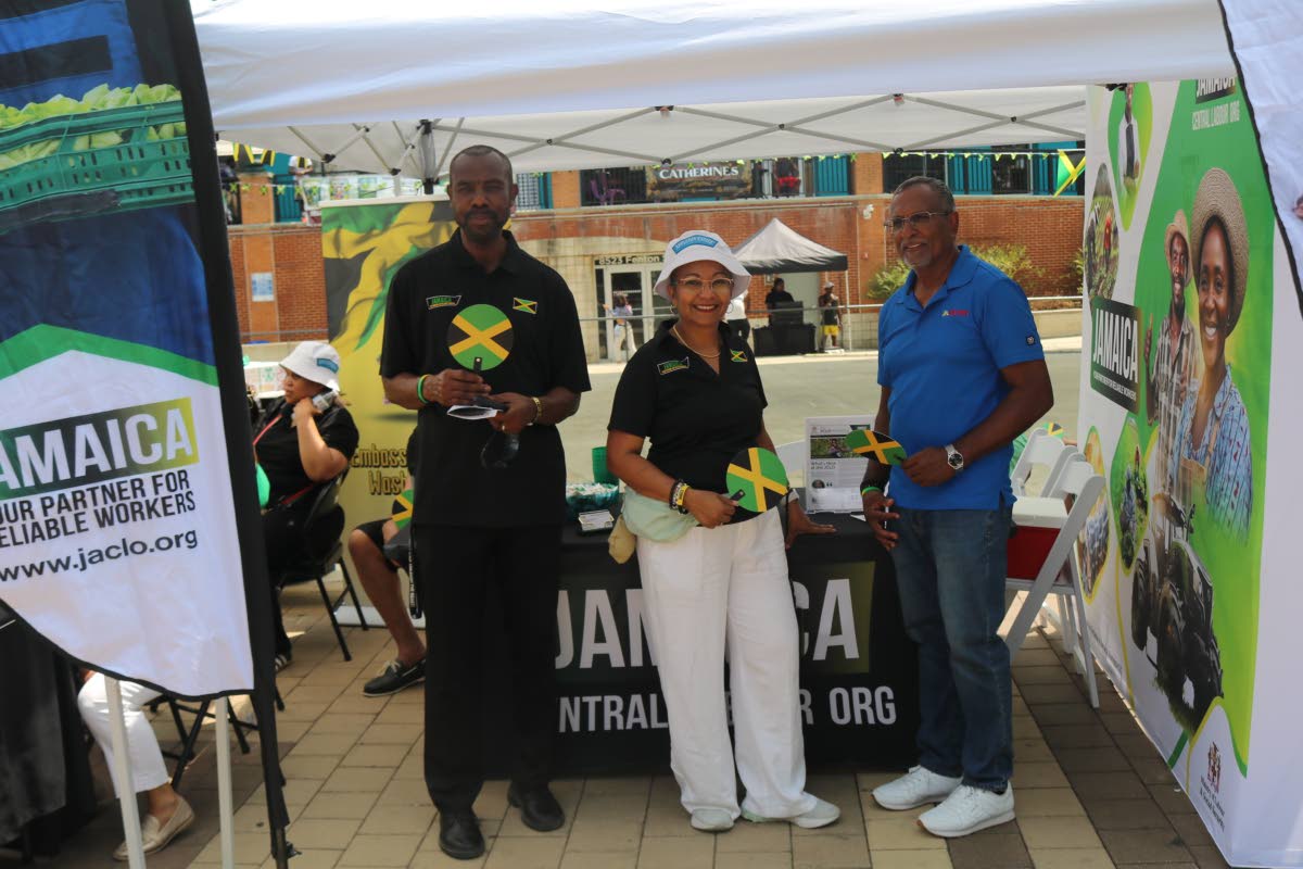 Permanent Secretary in the Ministry of Labour and Social Security and head of Jamaica’s Overseas Employment Programme in Washington, DC, Colette Roberts Risden (centre), speaks with Harry Bhoorasingh, senior country manager of JN Money Services USA, at t
