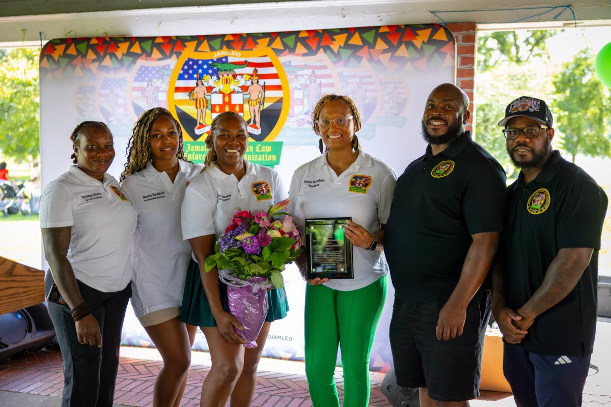 From left: Lieutenant Taneese Silvera, Detective Nickita Beckford, Detective Stacy Ann Kennedy, Lieutenant Danae McFarlane, Police Officer Rohan Lumsden, Detective Omar Wallace at the BBQ, Glen Island Park, New Rochelle, New York. 