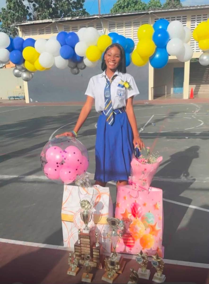 Taylor poses with the prizes and gifts she received following Papine High School’s 2026 graduation ceremony.