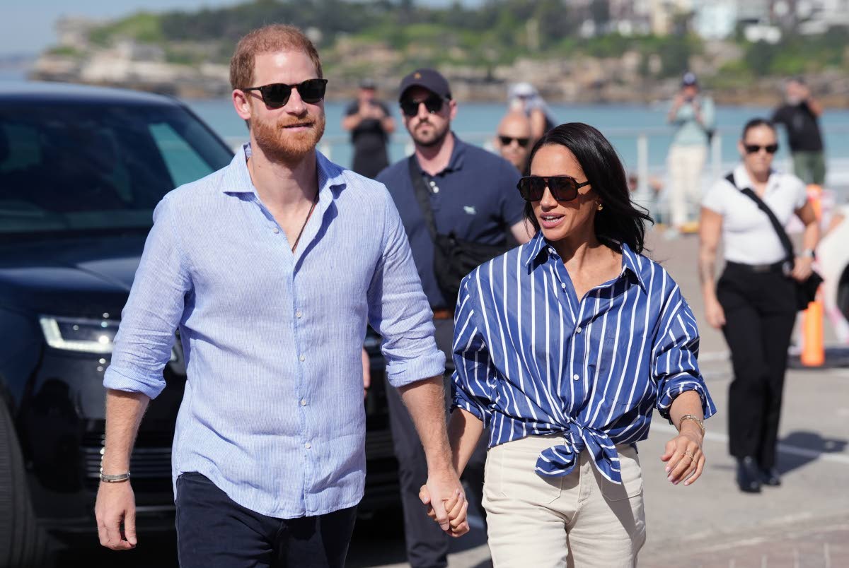 Prince Harry, and Meghan, the Duke and Duchess of Sussex, arrive for an event in Australia in April 2026.