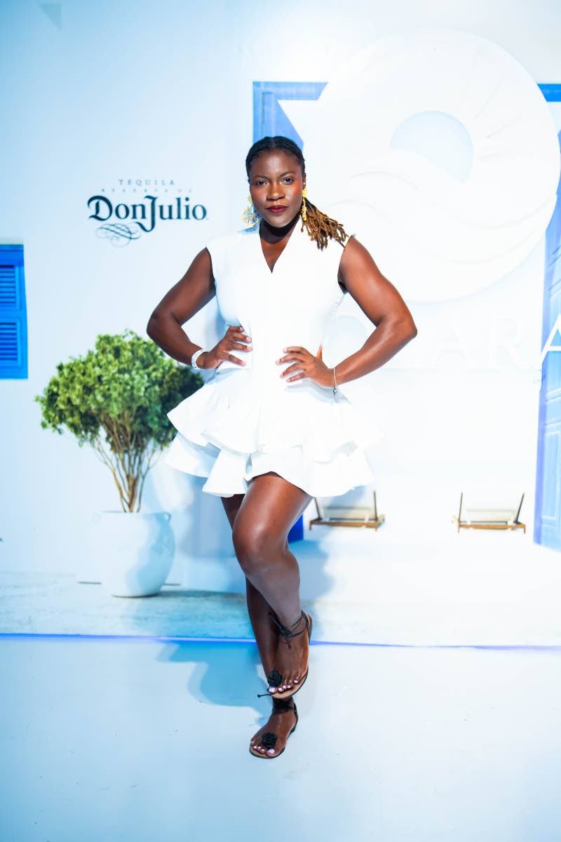 Red Stripe Spirits Trade Marketing Executive Chantalle Bryan puts a little bounce in the dress code, striking a playful pose for the lens.