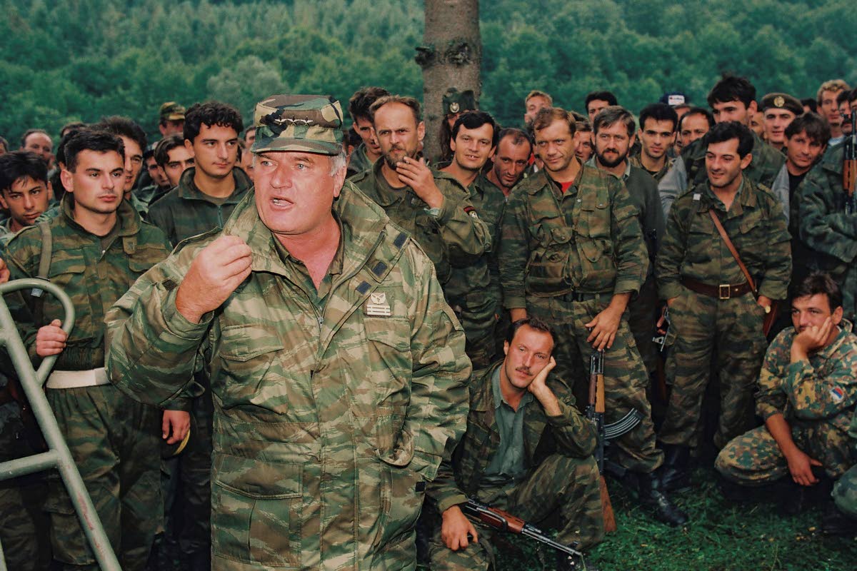 Bosnian Serb General Ratko Mladic speaks to soldiers near the Bosnian town of Cazin, September 4, 1994.