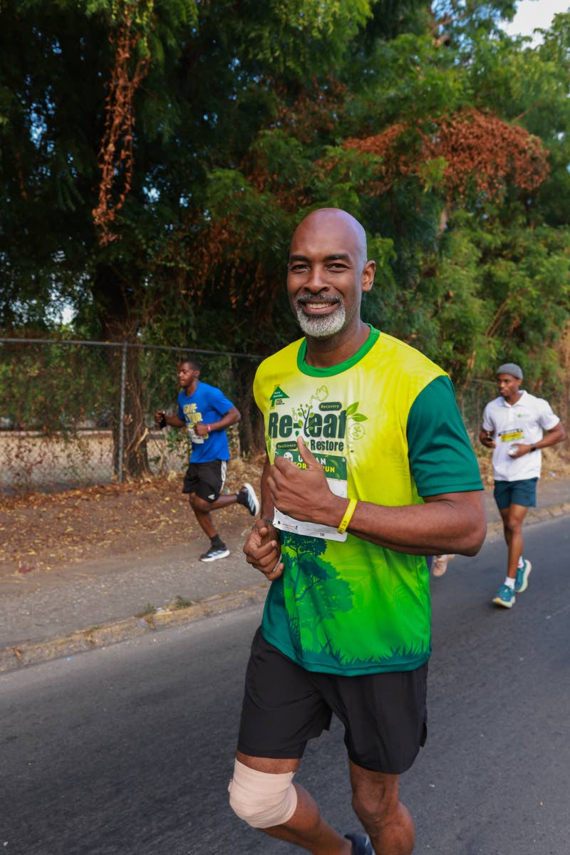 Feeling good as he approaches the finish line, Ainsley Henry, CEO and conservator of forests at the Forestry Department, gives the camera a thumbs-up.

