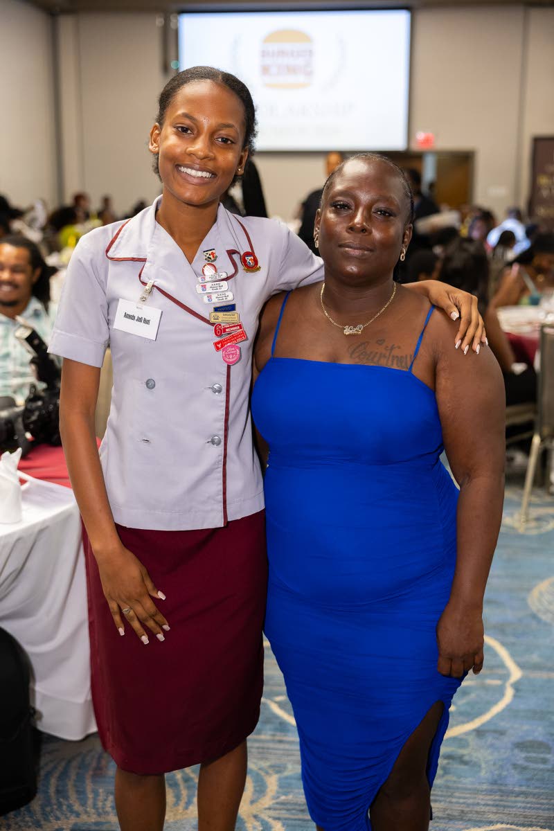 Amanda Hunt (left) happily embraces her biggest cheerleader, her mother, Latoya Perkins.