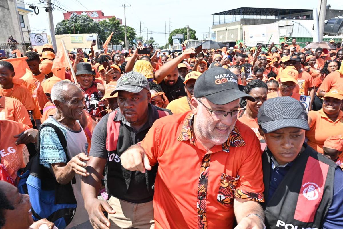 
People’s National Party (PNP) President Mark Golding surrounded by supporters during Nomination Day activities on August 18.