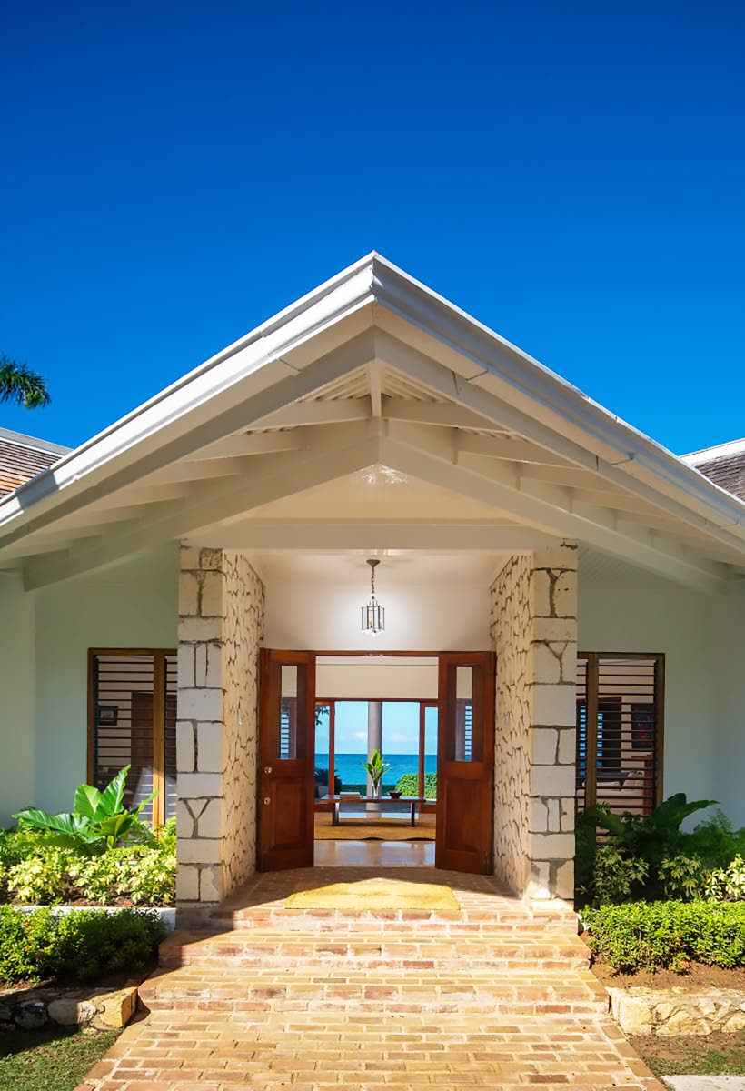 Enter through the front door and walk straight across the house to the seafront. 