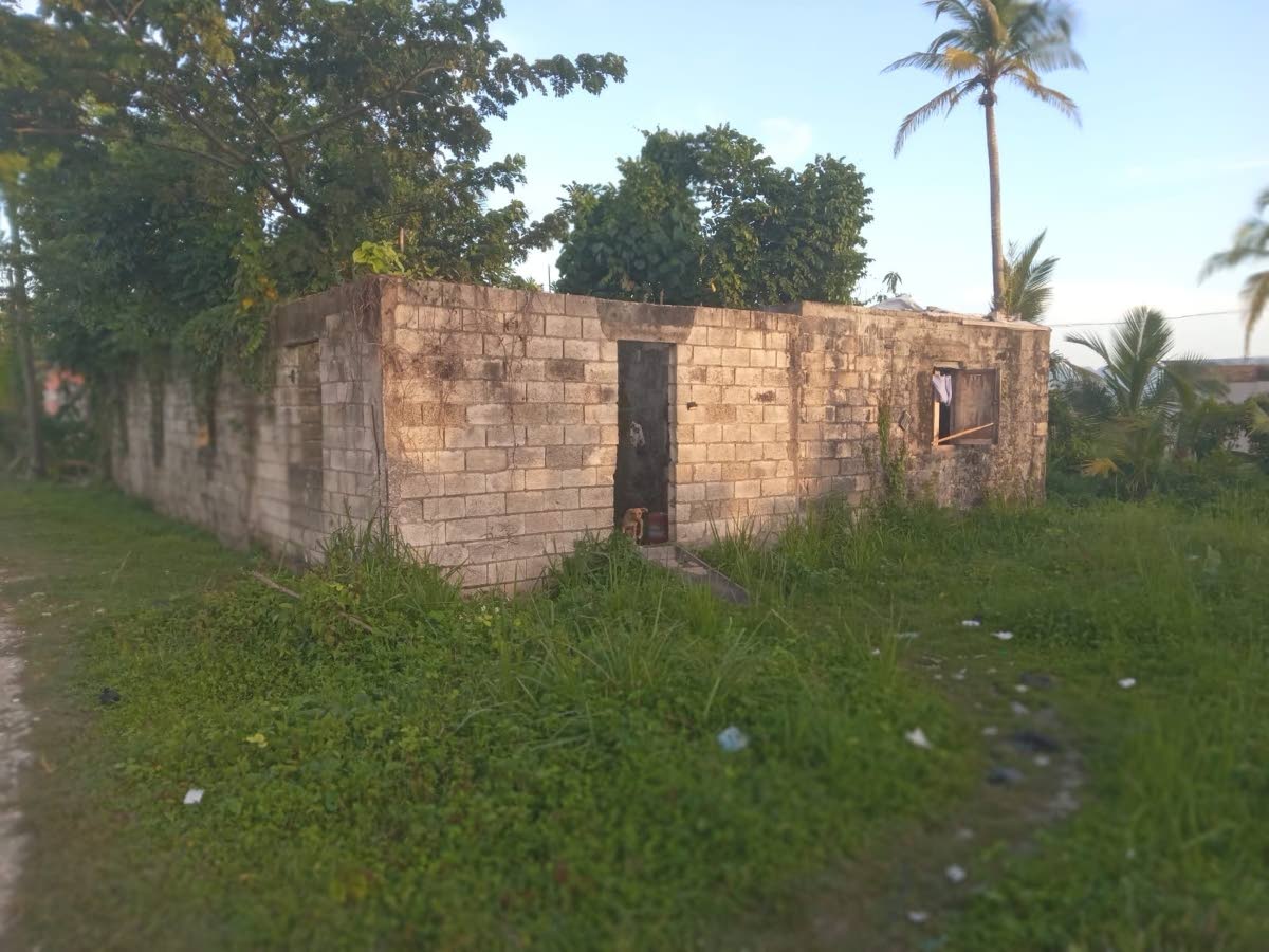 
The unfinished, abandoned structure in which the family is now sheltering.