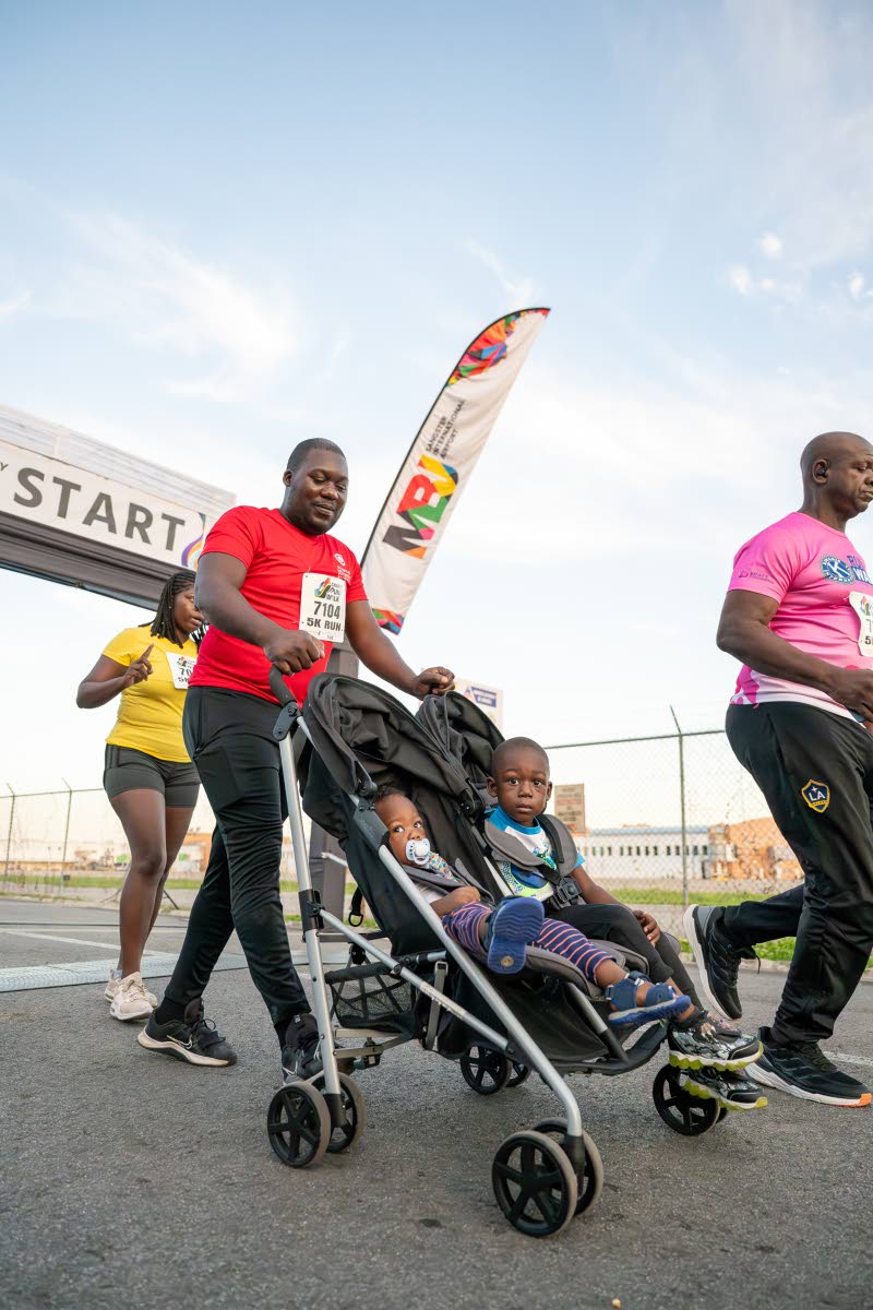 Babies can also join the fun at the MBJ Airports Foundation Charity 
Run/Walk event as this participant knows from the 2025 staging.
