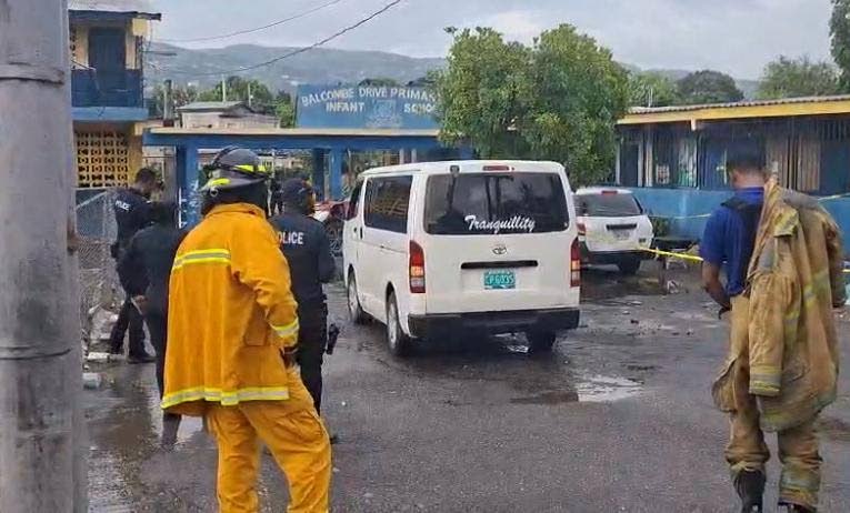 Police and firefighters at Balcombe Drive Primary and Junior High School in Olympic Gardens, St Andrew, where a section of a building collapsed, killing a man and injuring another on September 1, 2026. 