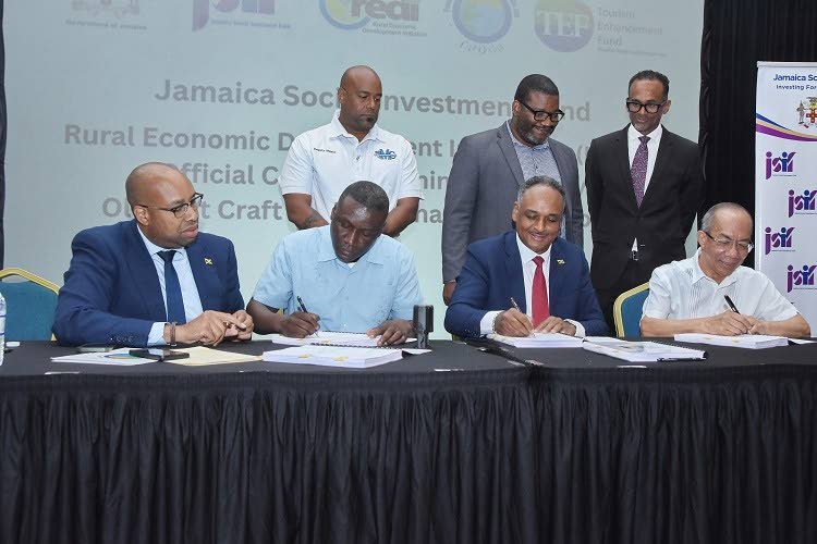 Seated from left: Delano Seiveright, chairman of the National Craft Council; Patrick Peterkin, principal of SM Quality Construction Limited; Omar Sweeney, managing director of the Jamaica Social Investment Fund; and Dr Horace Chang, deputy prime minister, 