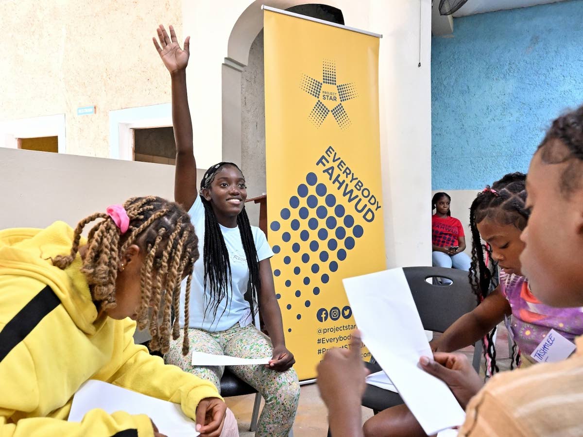 Regina Taylor, a youth leader from Savanna-la-Mar, Westmoreland, eagerly contributes during an interactive session at Project STAR’s inaugural Youth Summer Leadership Camp.