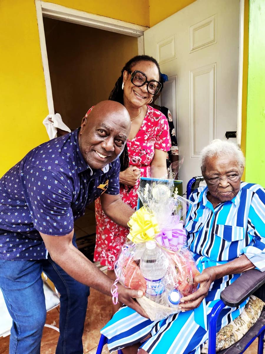 Councillor Lloyd Garrick (left) of the Moneague Division, Chairman of the Civic Affairs and Community Relations Committee Councillor Genevor Gordon-Bailey (centre), and centenarian Ilsa Maud Hinds, during a recognition visit at her home in Faith’s Pen, M