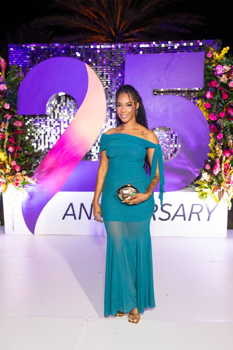 Shanoy Roberts, Guardian General Insurance Jamaica broker solutions associate, stuns in a teal off-the-shoulder mesh maxi.