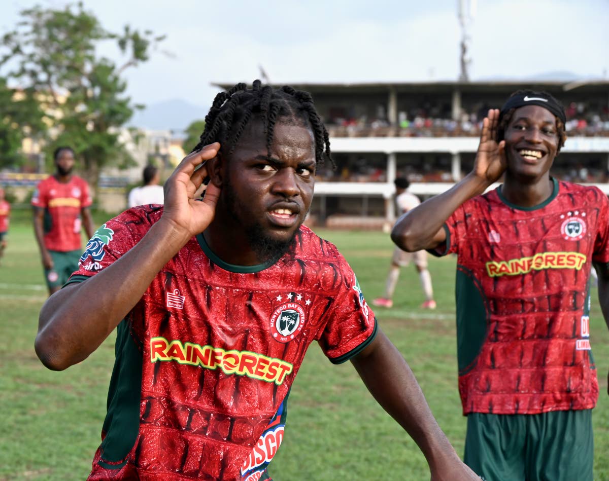Montego Bay United's Dwight Merrick (left) and teammate Deonjay Brown  celebrate a goal during their Jamaica Premier League football match against Chapelton Maroons at Jarrett Park on September 13. 