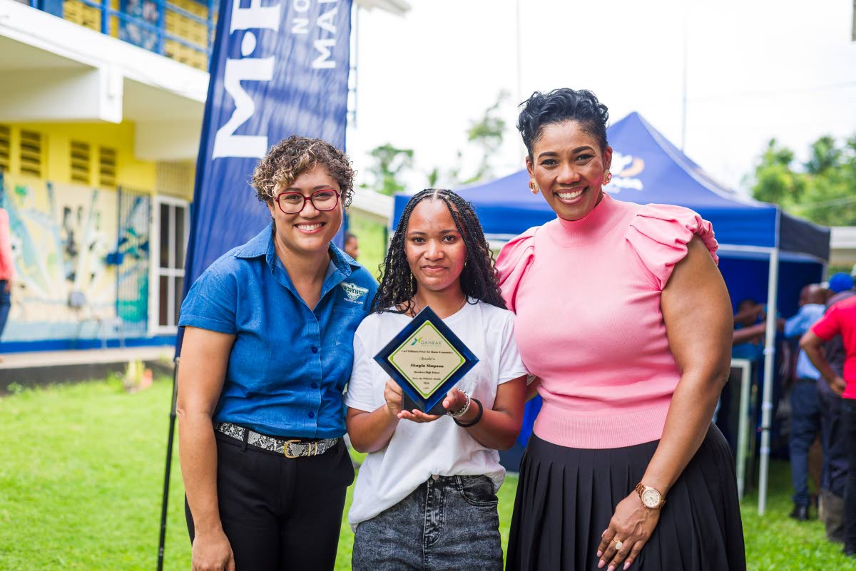  Aberdeen High School graduate Akayla Simpson (centre) poses with Wisynco head of consumer marketing Erin Mitchell (left) and Danrak Productions CEO Stacy-Ann Smith after receiving the inaugural Carl Williams Prize for Home Economics on Monday.