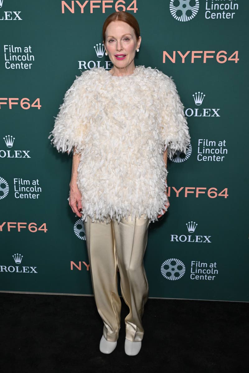 Julianne Moore channels understated elegance in a cream organza embroidered top and ivory silk trousers by Bottega Veneta.