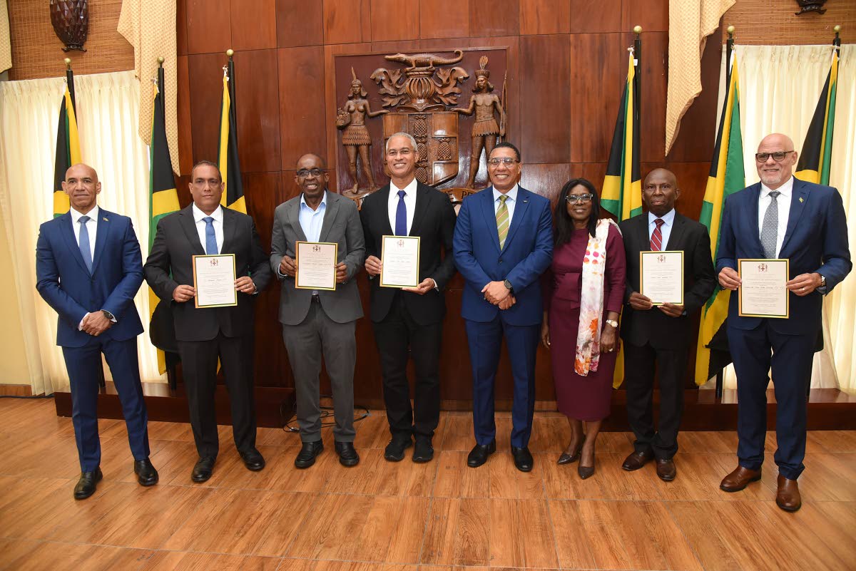 Prime Minister Dr Andrew Holness (fourth right), Audrey Sewell (third right), Cabinet Secretary, Ambassador Antony Anderson (left), Chief Executive Officer, National Reconstruction and Resilience Authority (NARRA), share a moment with members of the Jamaic