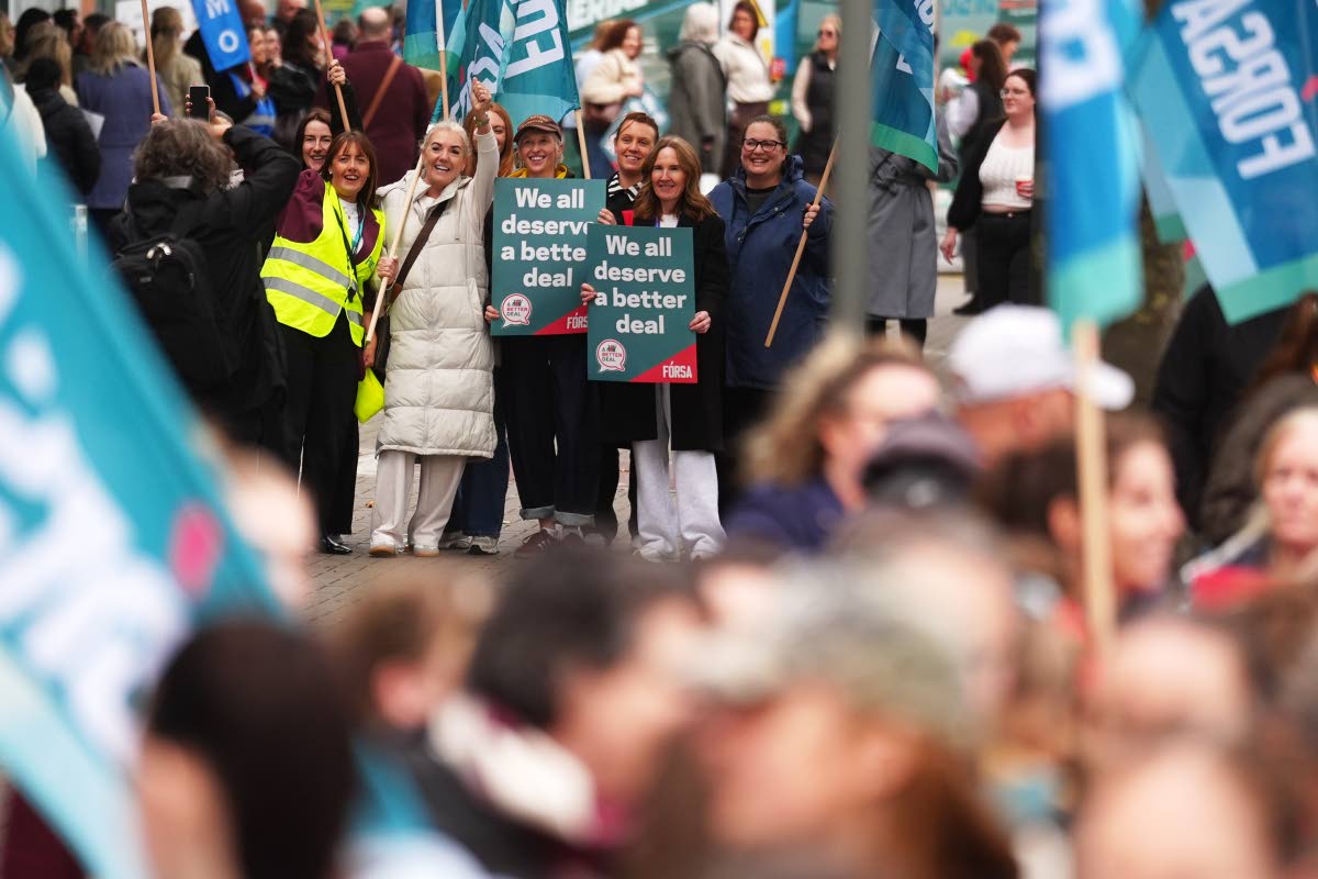 Public sector workers take part in a 24-hour strike over delays in agreeing a new public sector pay deal at Mater Hospital, Dublin, Ireland, Wednesday Oct. 14, 2026. (Brian Lawless/PA via AP)
