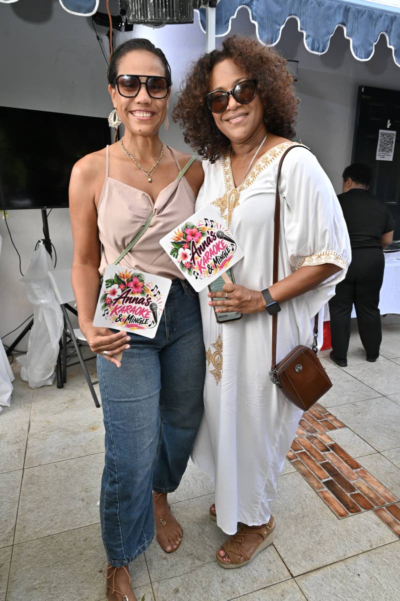 Jeunanne Alkins (left) and Dr Saphire Longmore share a camera-ready moment at the karaoke fundraiser. 