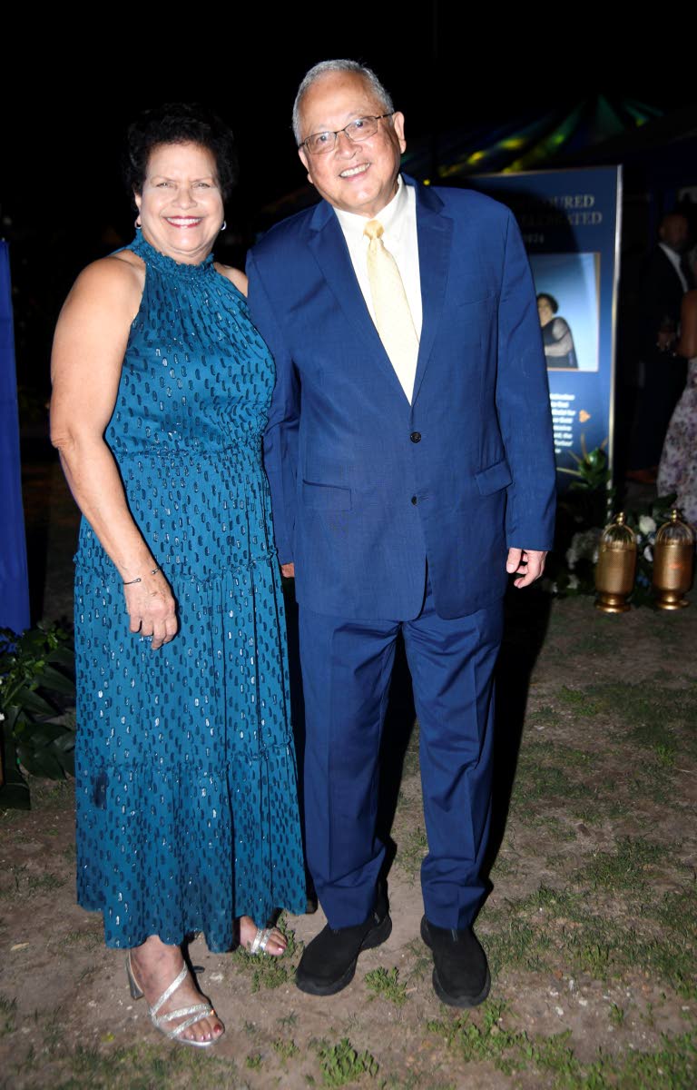 Justice Minister Delroy Chuck enjoys a light-hearted moment with his wife, Patricia.